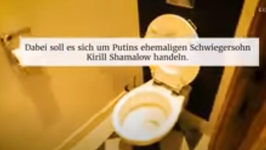 Pierre Afner在別墅外揮舞烏克蘭國旗,並進入別墅內部拍攝。(YouTube)