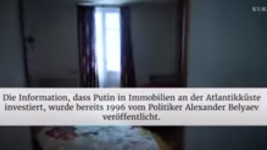 Pierre Afner在別墅外揮舞烏克蘭國旗,並進入別墅內部拍攝。(YouTube)