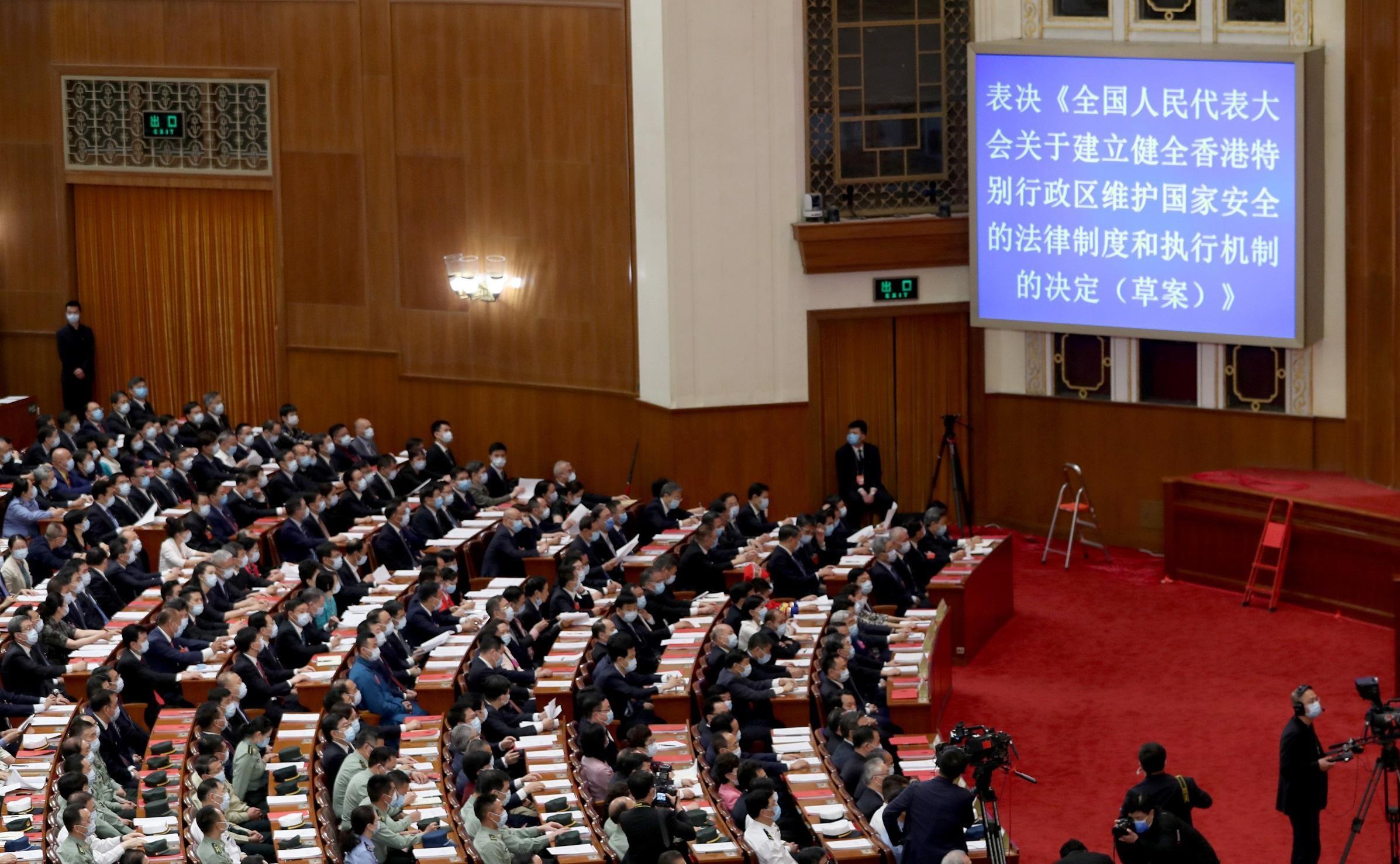 林鄭月娥在任特首期間,中央先後制定《港區國安法》及修改香港選舉制度。(新華社圖)