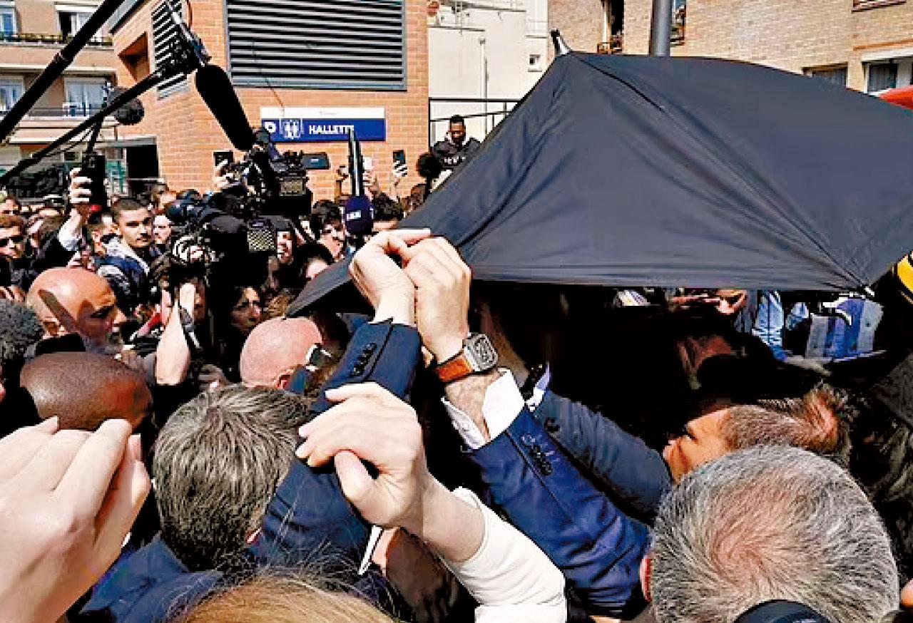 落區謝票|深入窮區爭左翼票源 馬克龍遭擲車厘茄