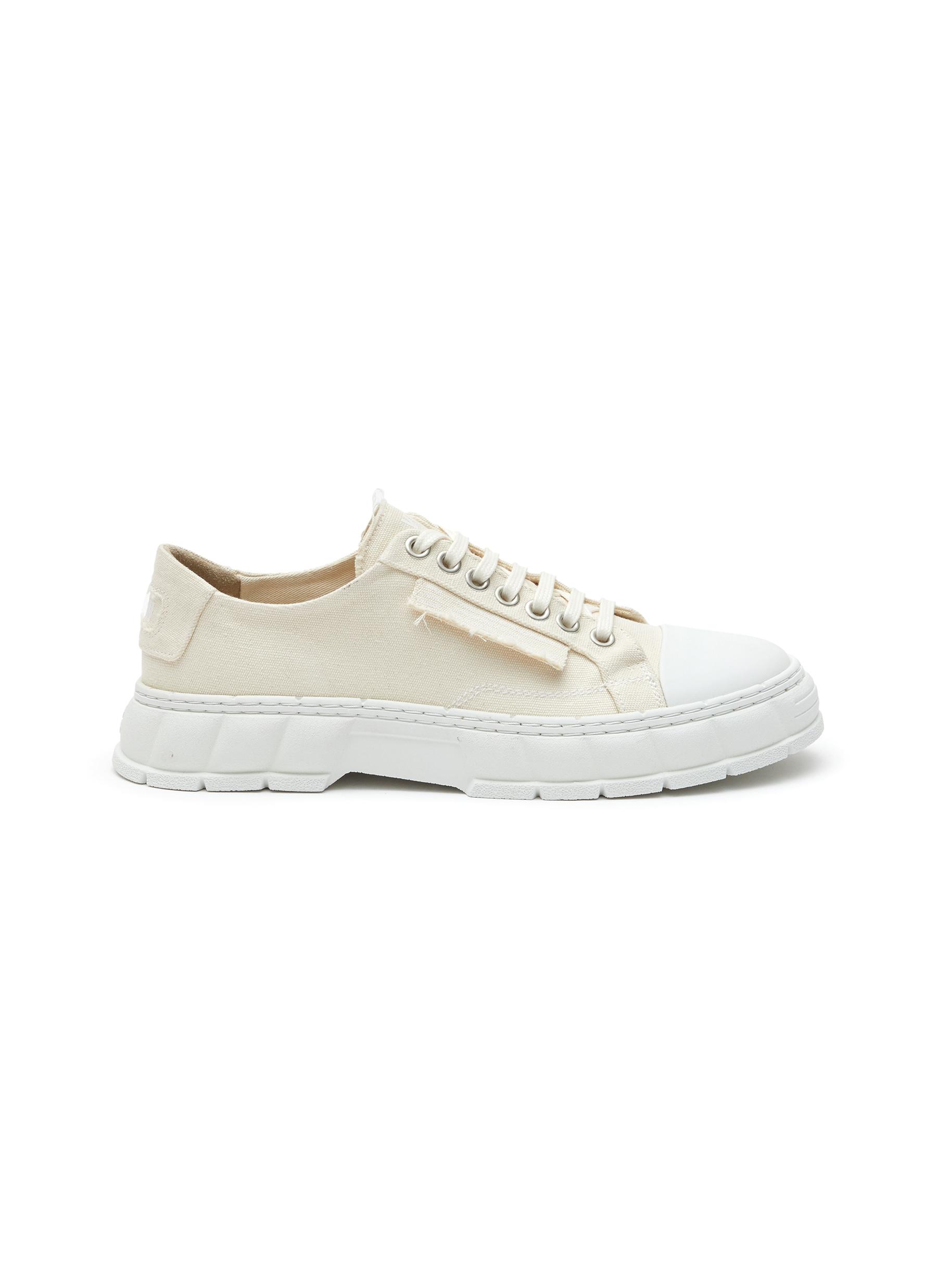 VIRÓN LOW TOP LACE UP CANVAS SNEAKERS $1,700 (available in Lane Crawford)