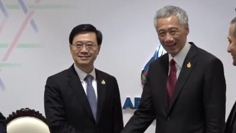 李家超曼谷晤李顯龍。(電視截圖)