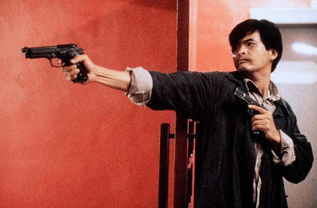 1986年上映的《英雄本色》,票房達3,400多萬,是當年的票房冠軍,更令周潤發洗去「票房毒藥」污名。(《英雄本色》劇照》)