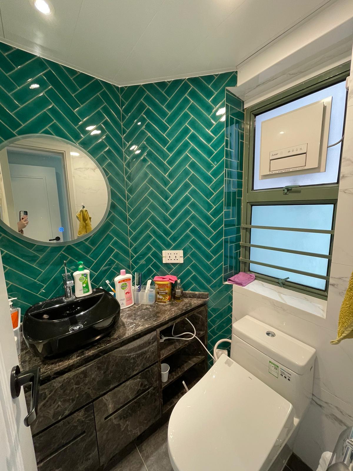 墨綠色瓷磚鋪砌,裝修時尚新淨。(代理提供)