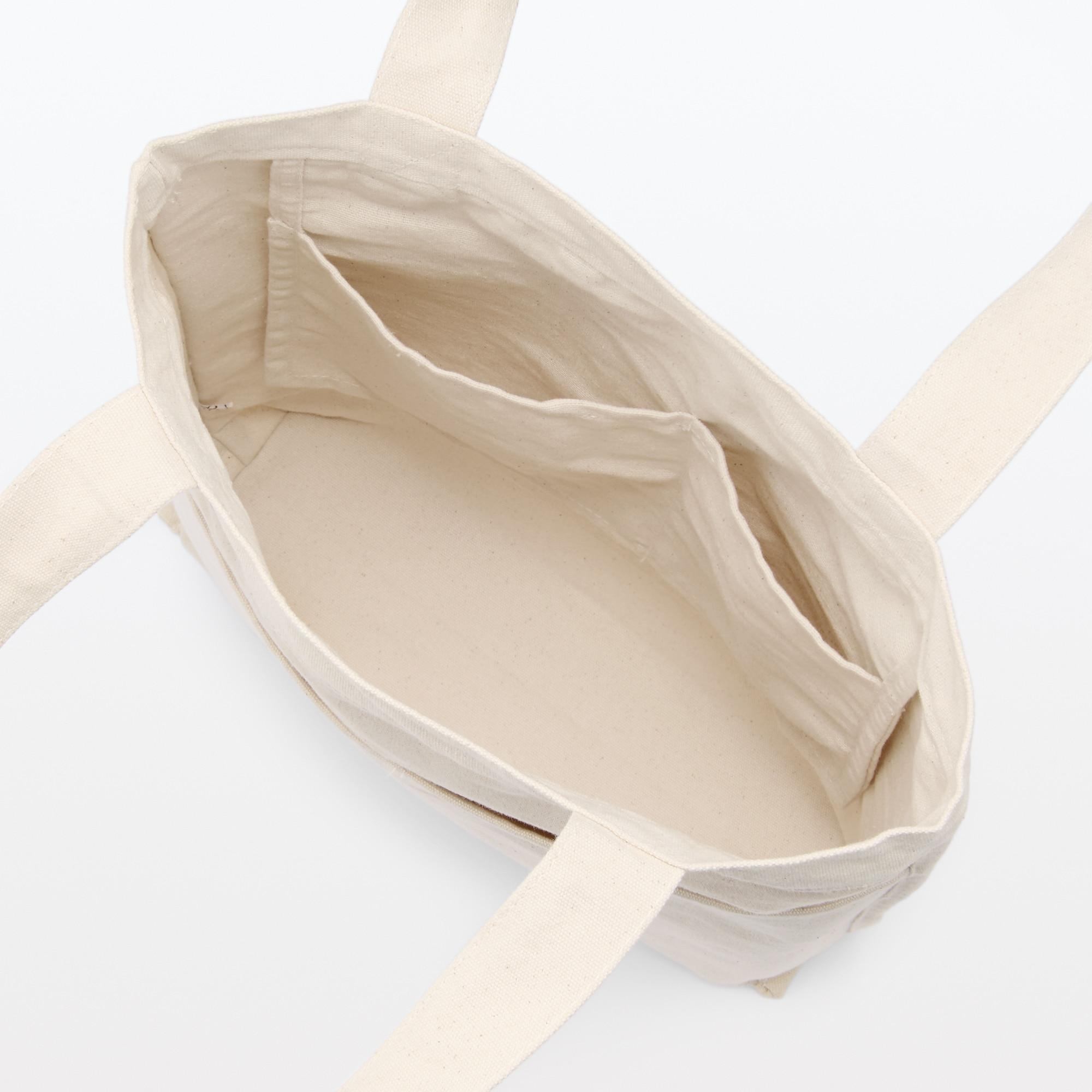 有機棉帆布直型手挽袋│大容量設計可存放各種隨身用品,適合外出工作或上學時使用。HK$125