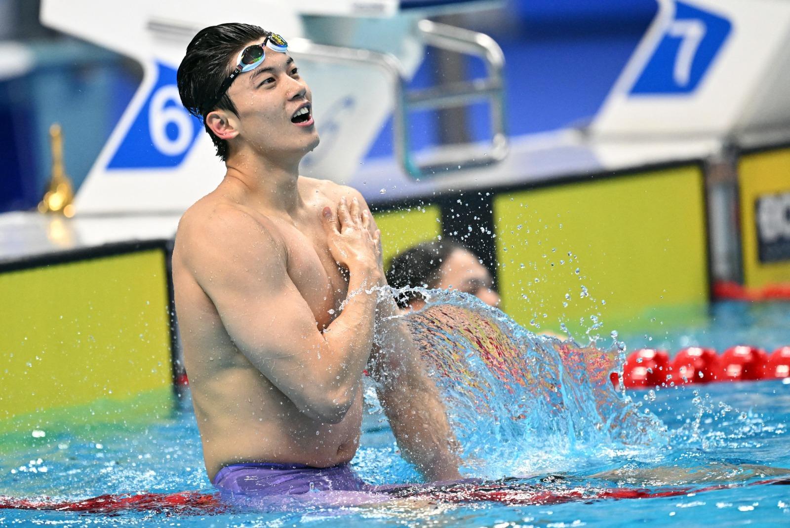 杭州亞運中國游泳「男神」汪順撞樣許光漢。(路透社)