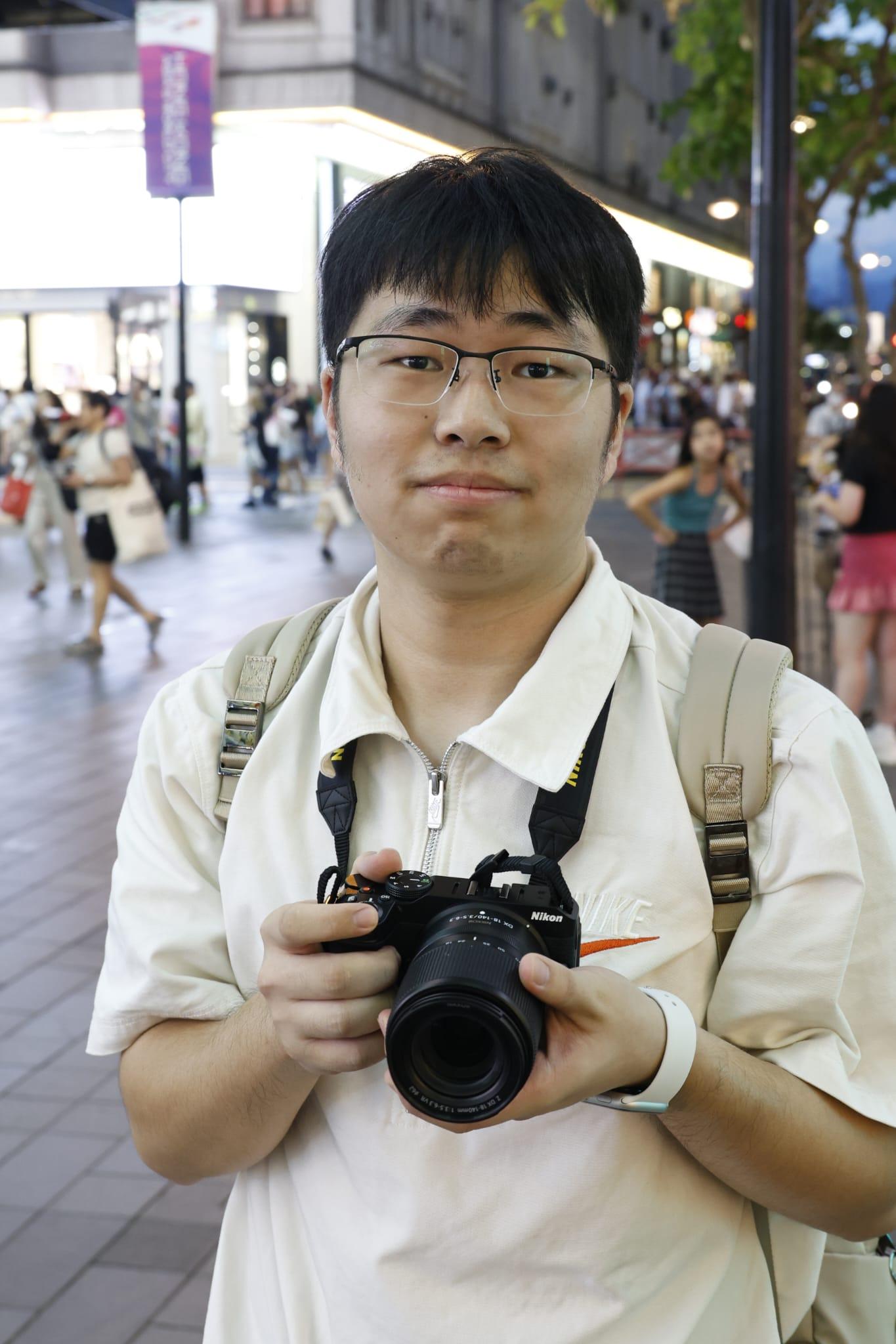 徐先生表示因為體驗香港文化訪港。(林俊源攝)