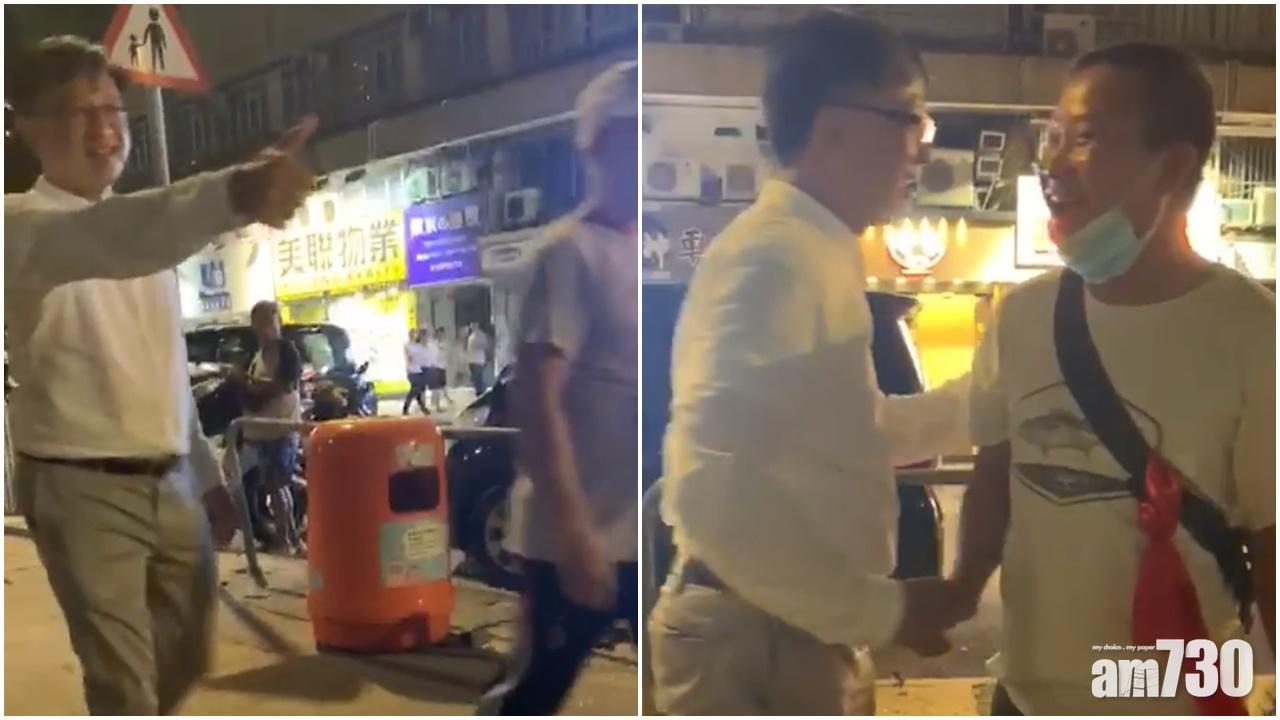 何君堯被影到當晚向白衫人豎起姆指,又與他們握手。(資料圖片)