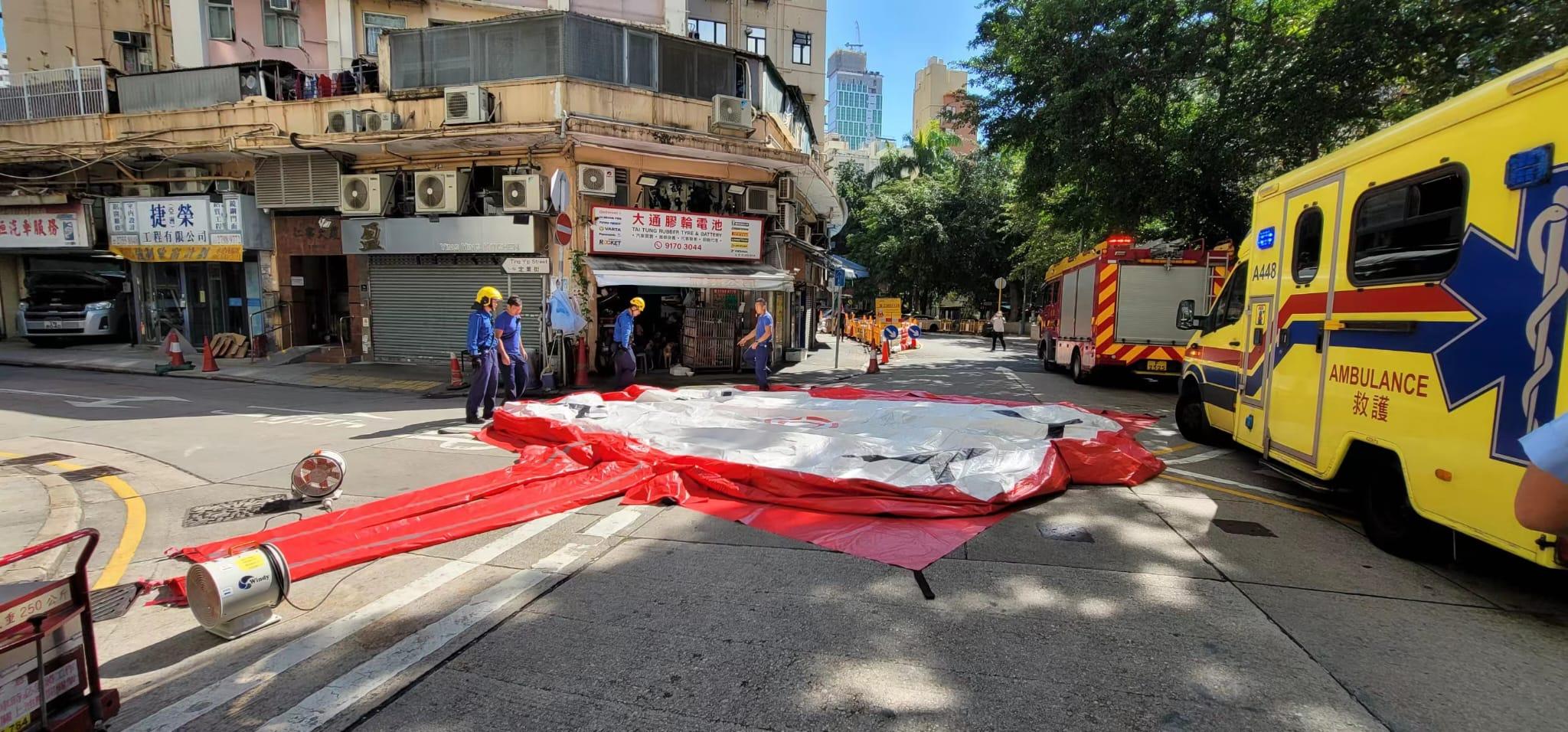 牛頭角老婦危坐大廈窗台 消防「飛將軍」及時救回屋內