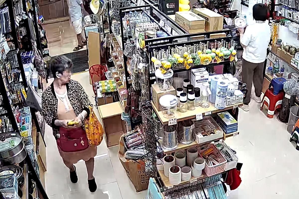 將軍澳一間家品店被一名女子盜取環保袋,全程被店內閉路電視拍下。(網上影片截圖)
