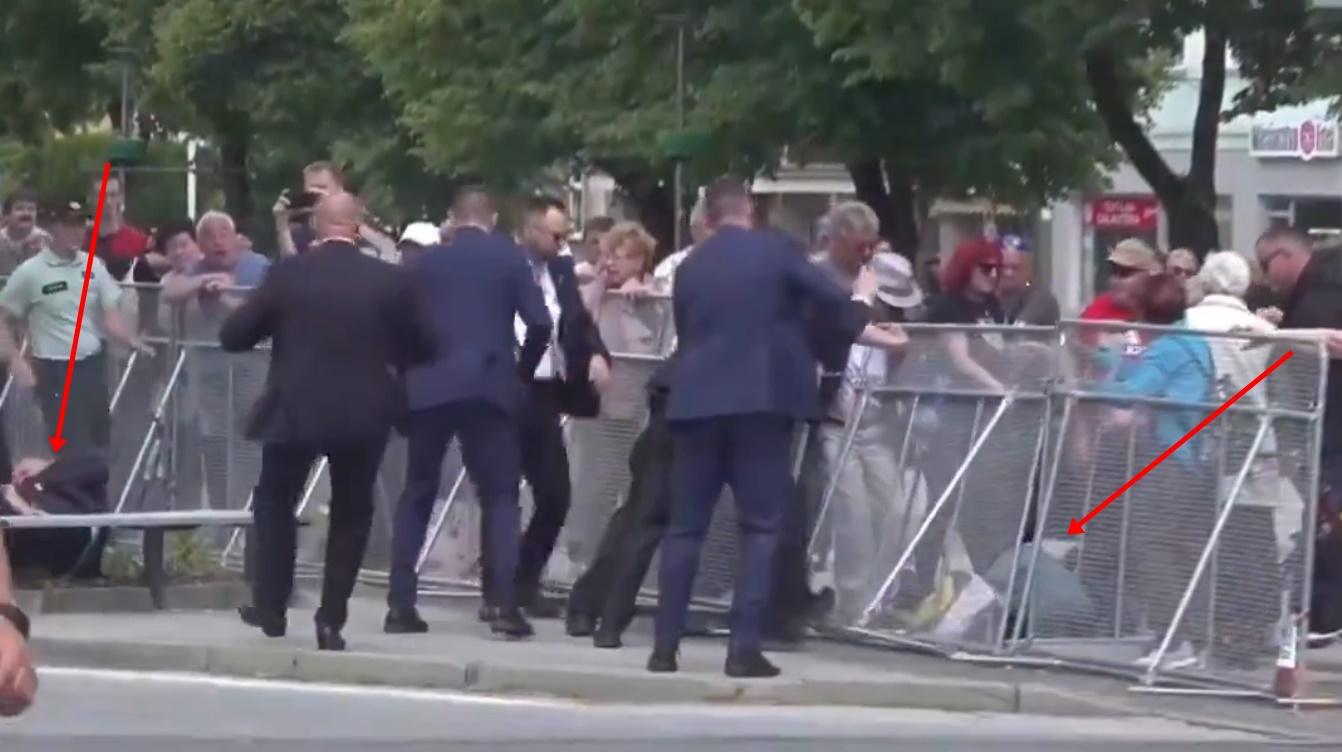 菲佐手按腹部倒臥地上。(X)