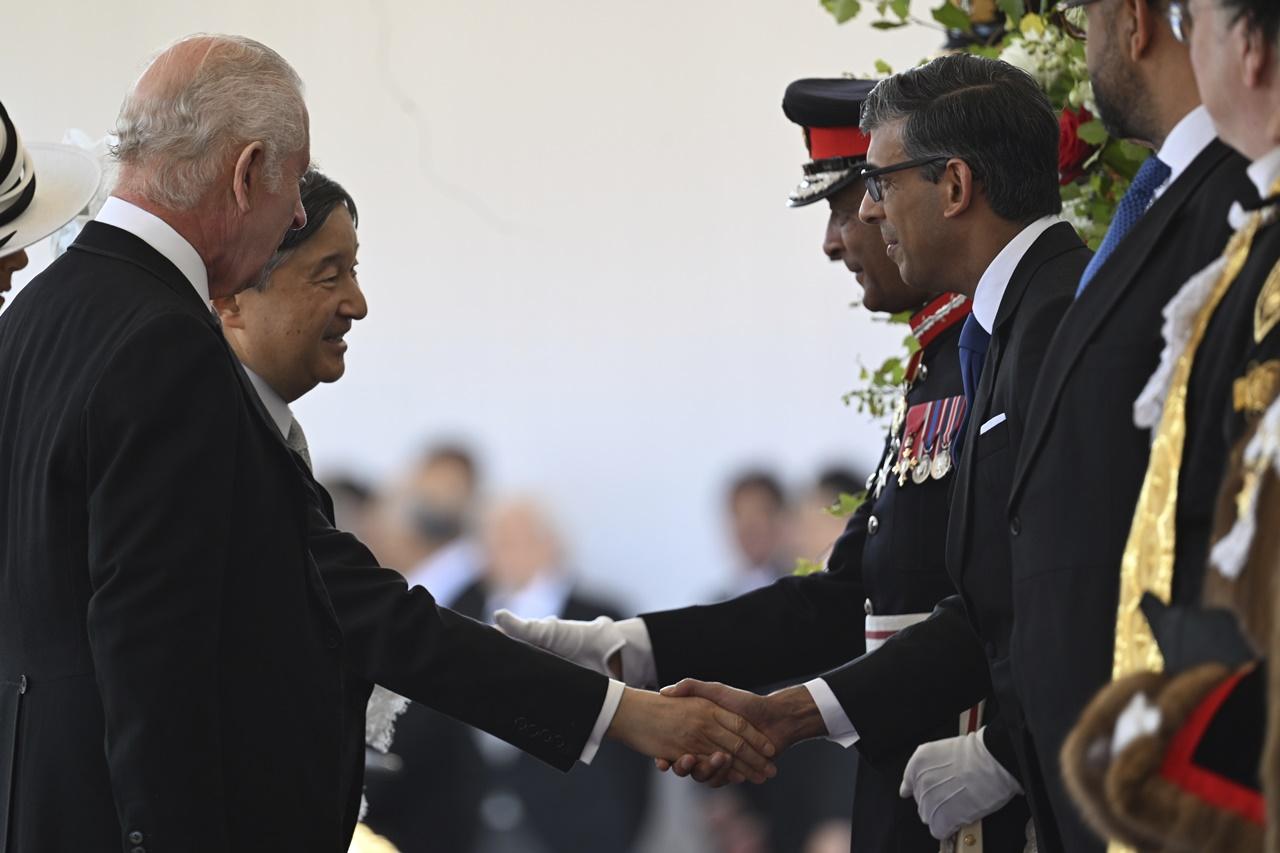 事發時辛偉誠正接待日皇伉儷。(AP)