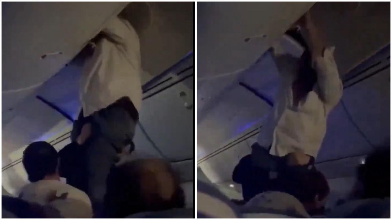 機艙有幾名乘客協助一名被拋到行李架上的乘客返回座椅。(X)