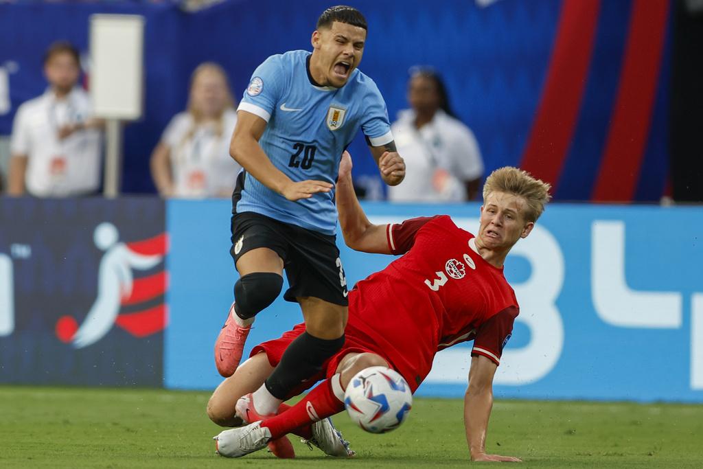 加拿大與烏拉圭2:2言和,烏拉圭互射12碼勝出。(美聯社)