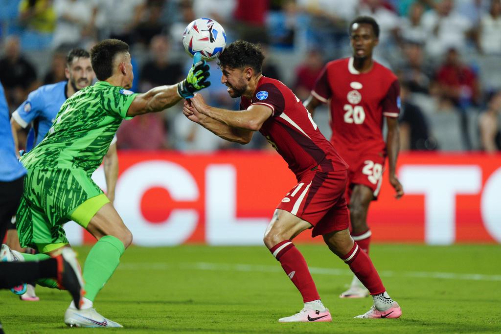 加拿大與烏拉圭2:2言和,烏拉圭互射12碼勝出。(美聯社)