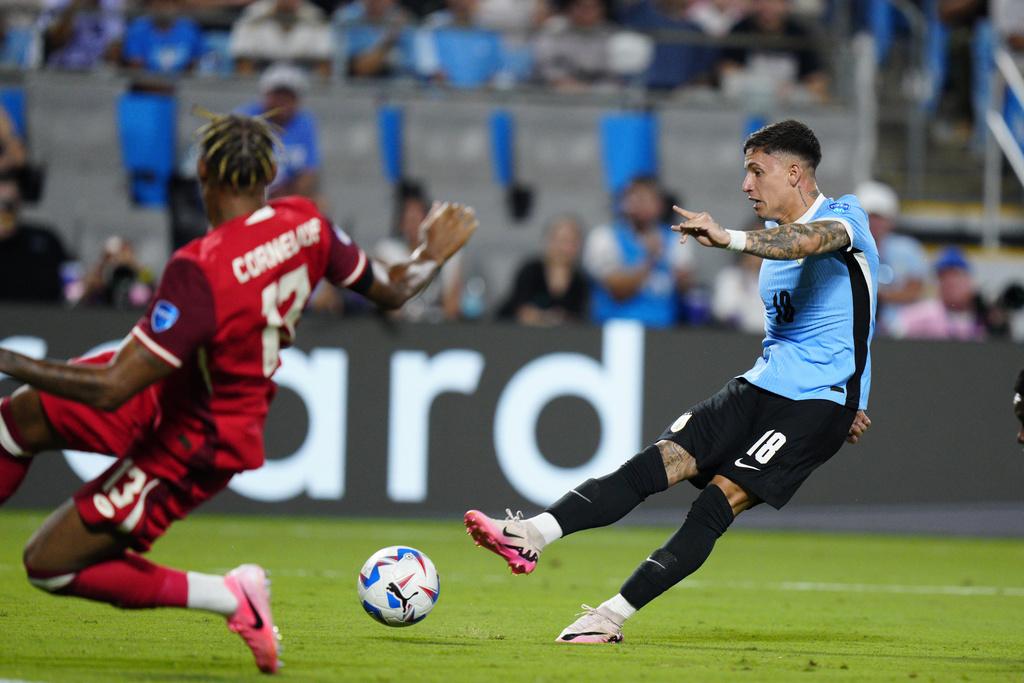 加拿大與烏拉圭2:2言和,烏拉圭互射12碼勝出。(美聯社)