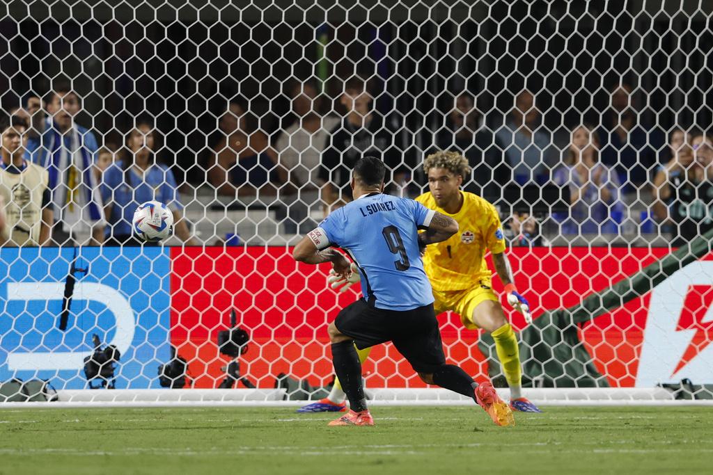 蘇亞雷斯補時為加拿大追平2:2。(美聯社)