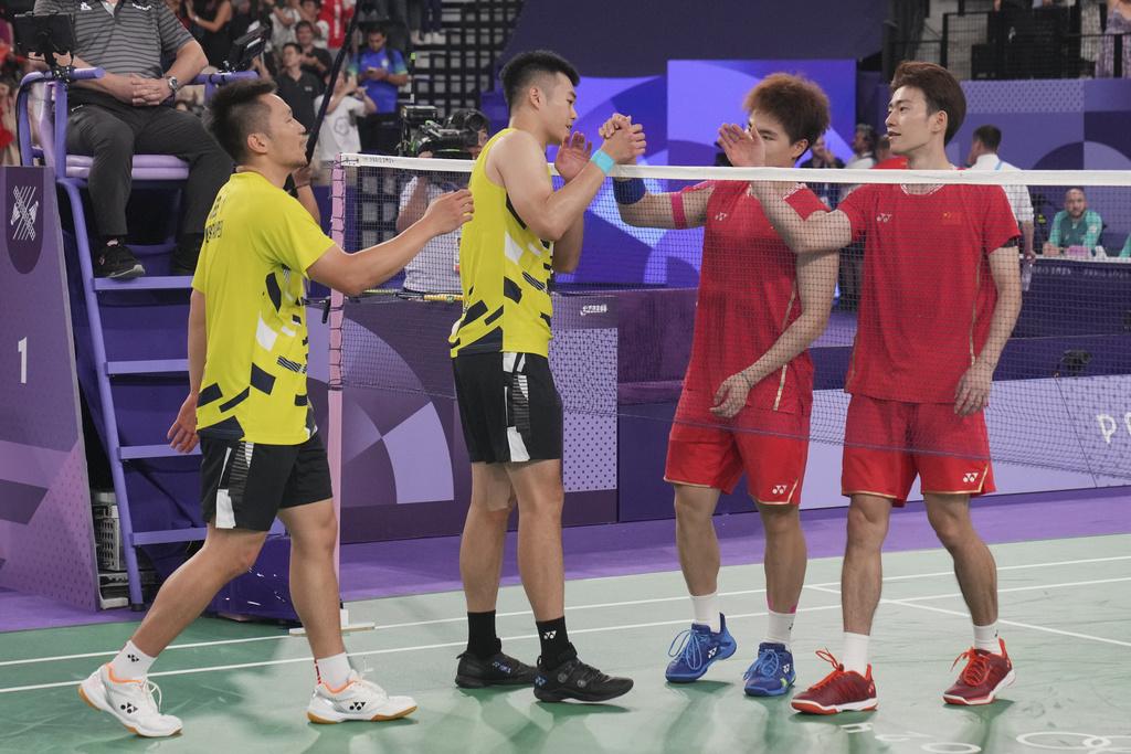 兩隊激戰三局,中國隊惜敗,未能囊括所有羽毛球雙打金牌。(美聯社)