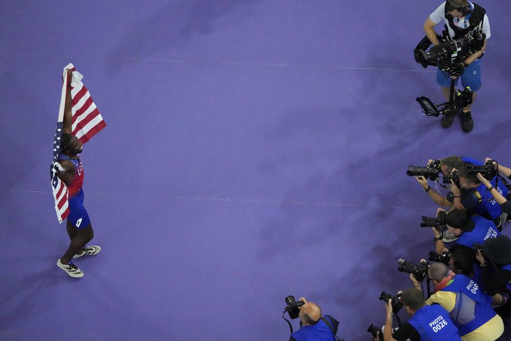 利里斯於決賽跑出9.79秒,力壓牙買加的湯臣摘金。(美聯社)