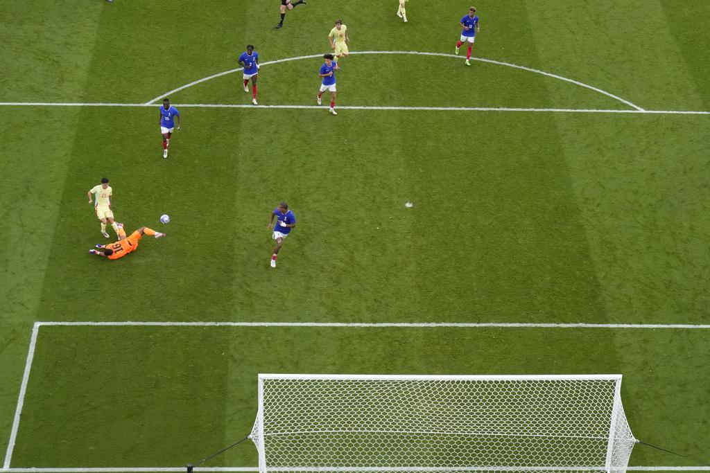 西班牙憑著卡美路於加時梅開二度,以5:3擊敗法國摘金。(美聯社)