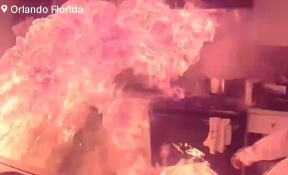 男子再上前一手將著火平底鑊丟到地上。(X)