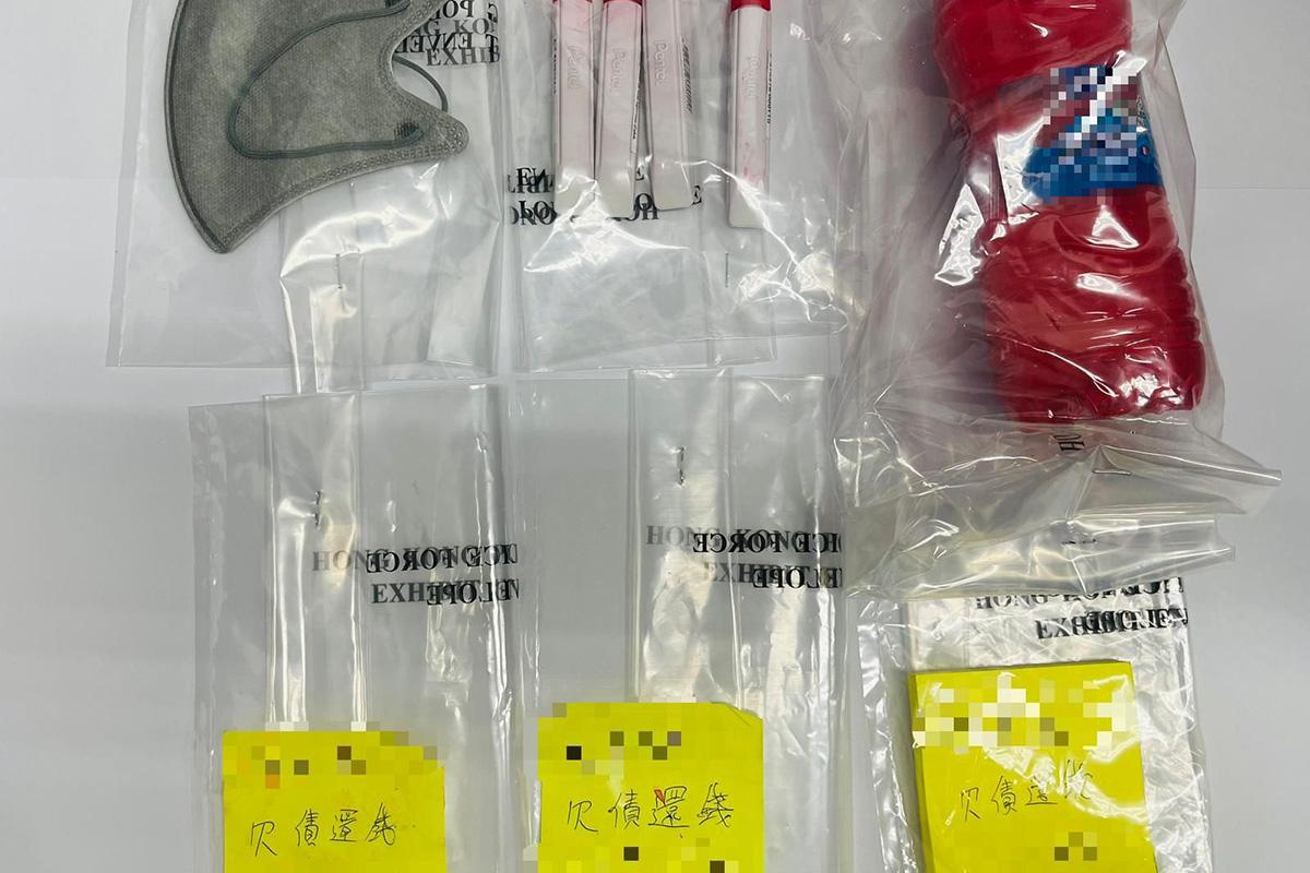 警方行動中檢獲紅油和收數紙。(警方提供)