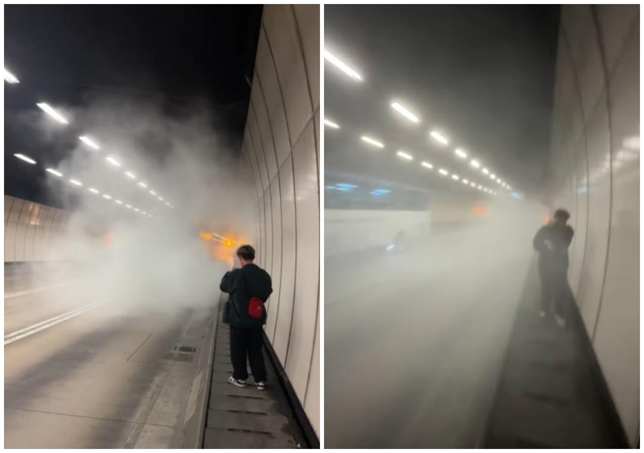 涉事的巴士在管道內冒出濃煙並起火,乘客下車後站在管道旁石壆上等待救援。(車cam L(香港群組)@FB)