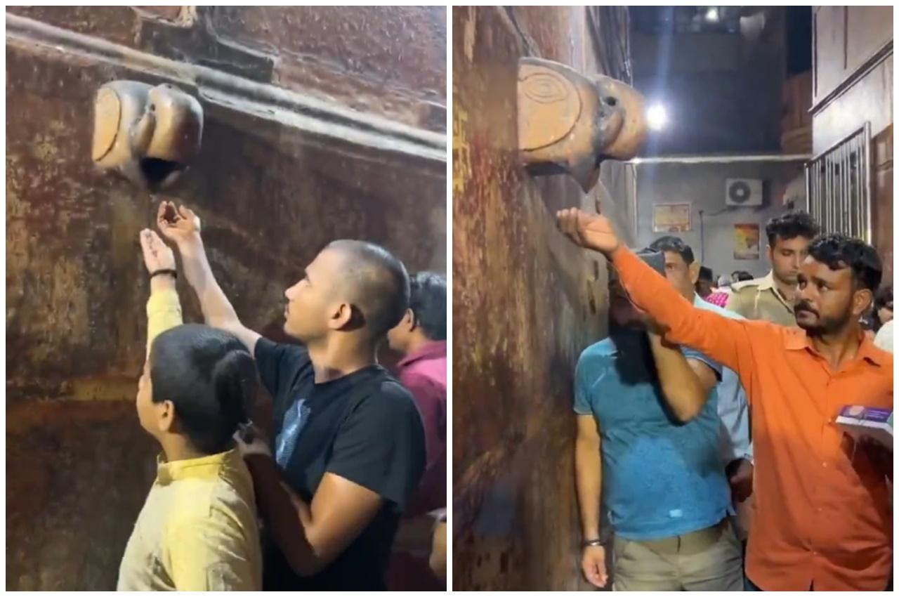 雕像前聚集了大批民眾,有人用手或用器皿接「聖水」享用,亦有人將水塗抹頭部身體。(X)