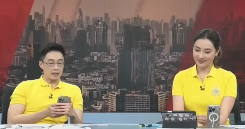 男主播讀出電視台裁員300人的「通知信」時手震。