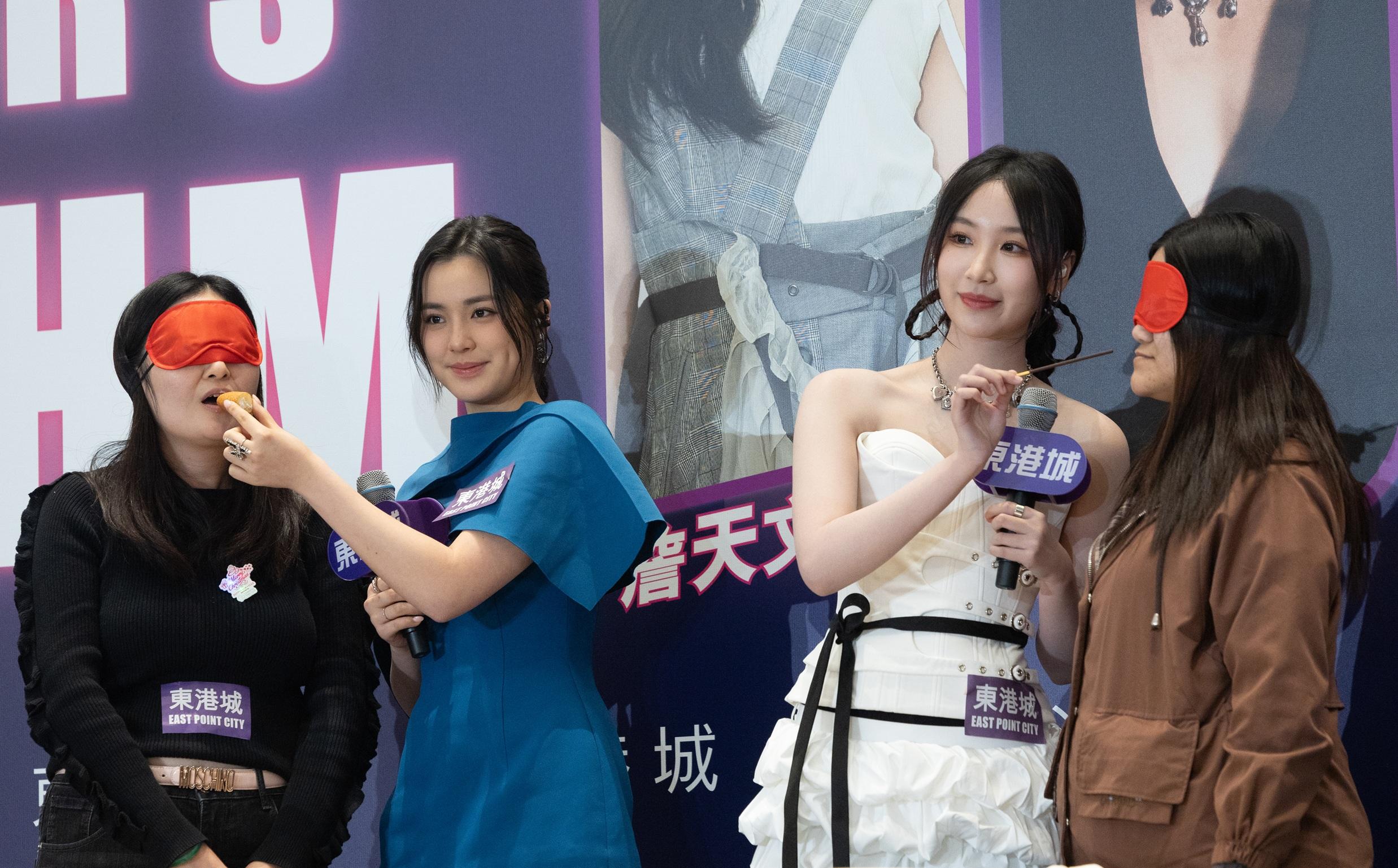 Chantel和Windy與兩位fans大玩餵食遊戲。(蘇文傑攝)