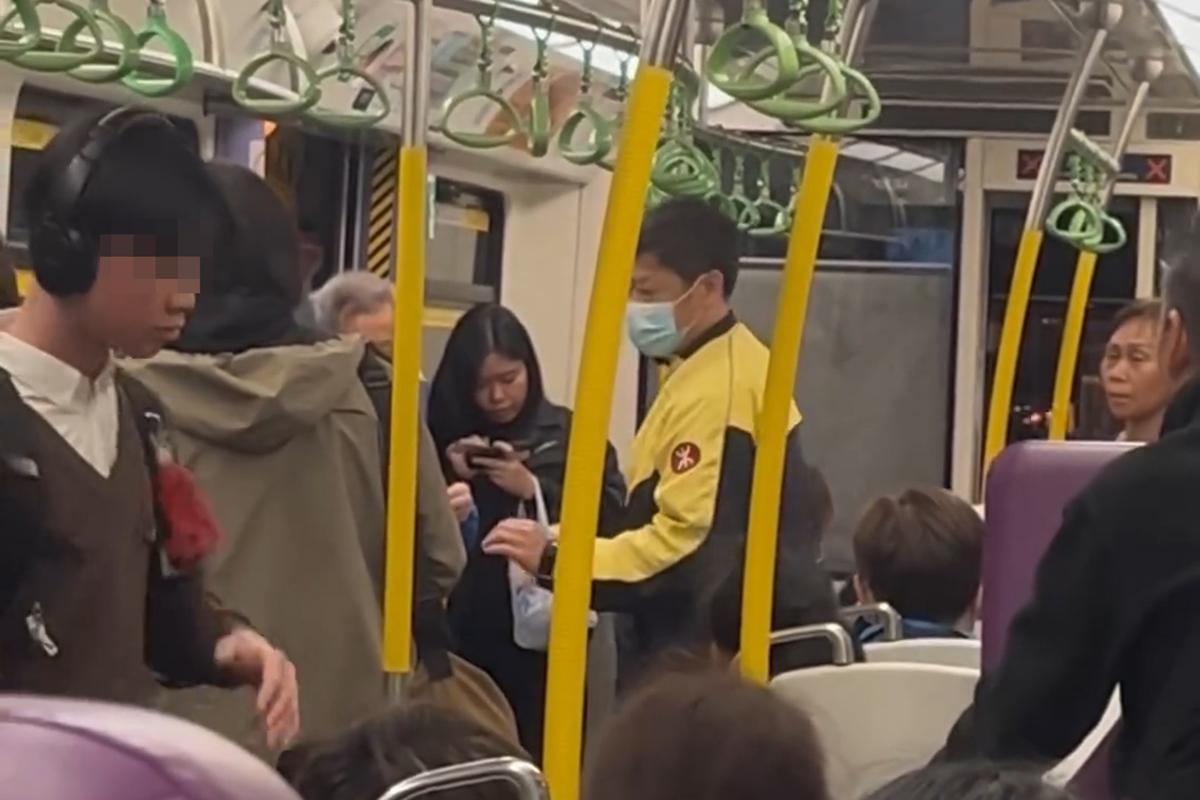 港鐵有乘客就車廂飲食斥責其他人,同時有男學生正從容地聽音樂擺動身體,相映成趣。(Threads影片截圖)