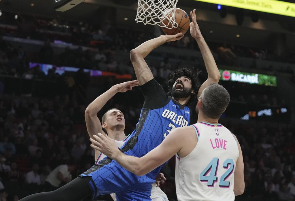 熱火加時125:119擊敗魔術。(美聯社)