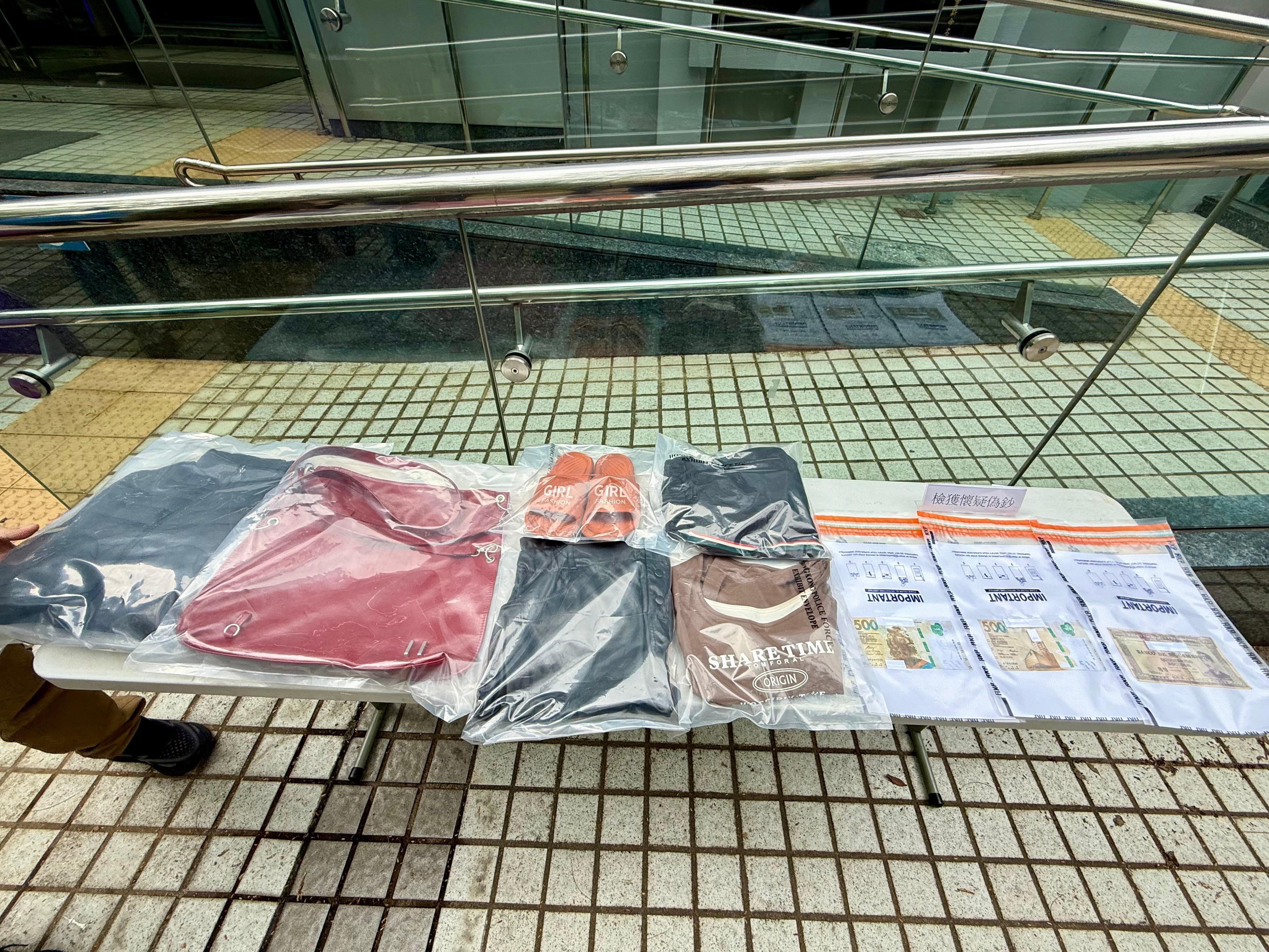 一名39歲無業女子以500元偽鈔騙取現金找贖。圖示為檢獲證物。