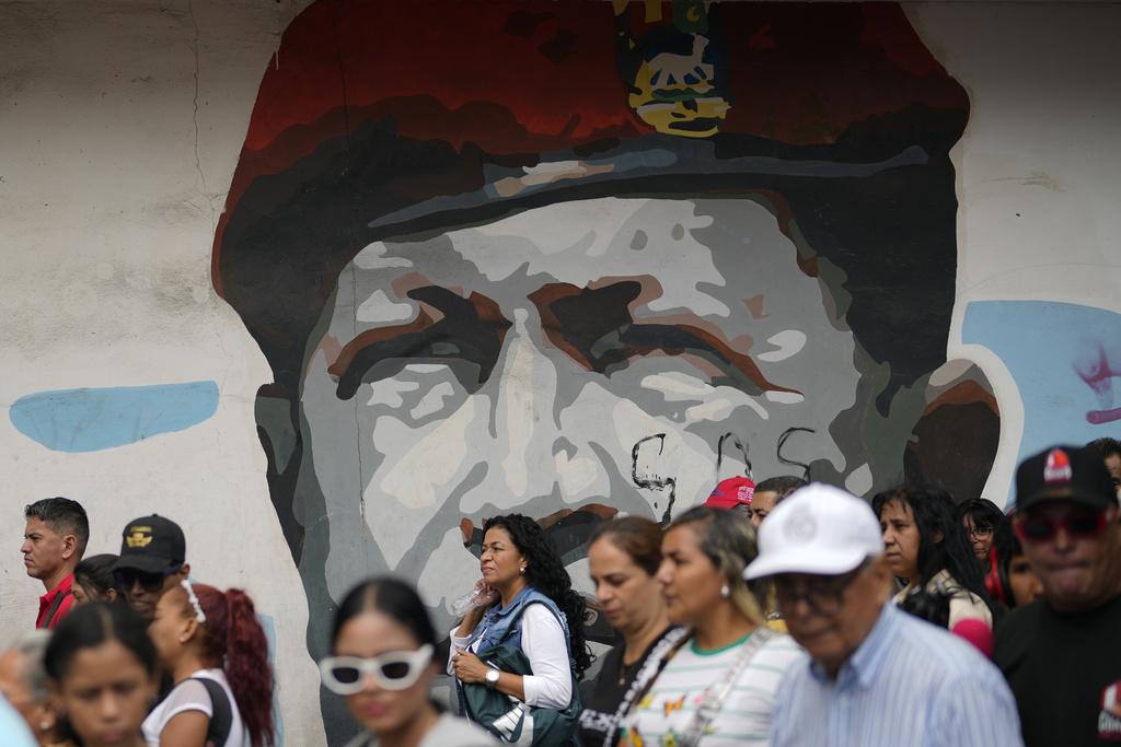 委內瑞拉民眾周二在首都加拉加斯遊行示威,抗議美國把委國黑幫成員送到薩爾瓦多監禁。(美聯社)