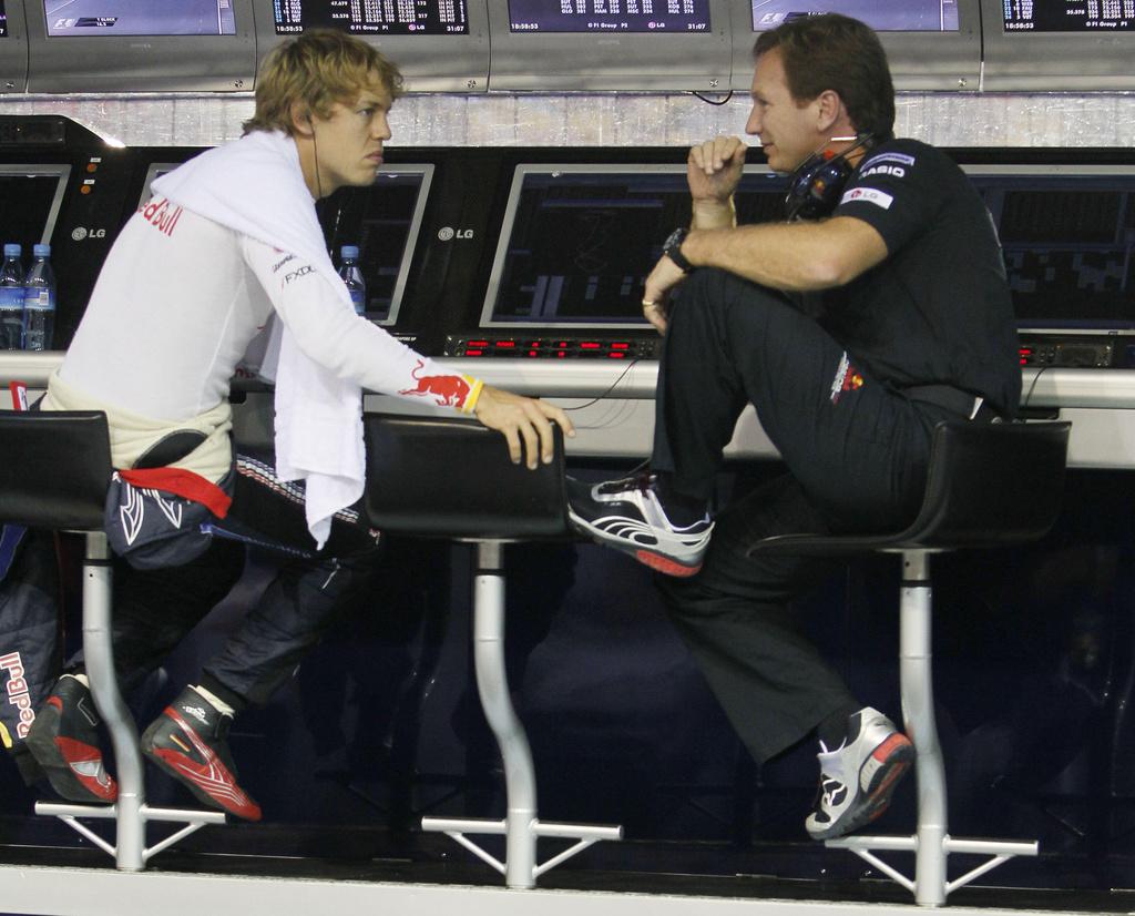 維迪爾(Sebastian Vettel)在漢拿(Christian Horner)之助下4度成為F1世界冠軍。(資料圖片)