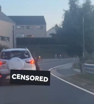 從影片可見,德國牧羊犬頸部被緊緊地綁在私家車右邊車身外,一路被高速拖行。(互聯網)