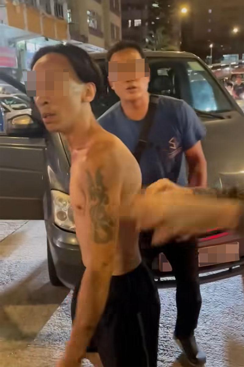 有司機在享和街與鄰近車房職員,因停泊咪錶位問題發生爭執。(網上影片截圖)