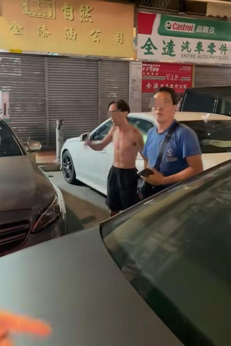 有司機在享和街與鄰近車房職員,因停泊咪錶位問題發生爭執。(網上影片截圖)