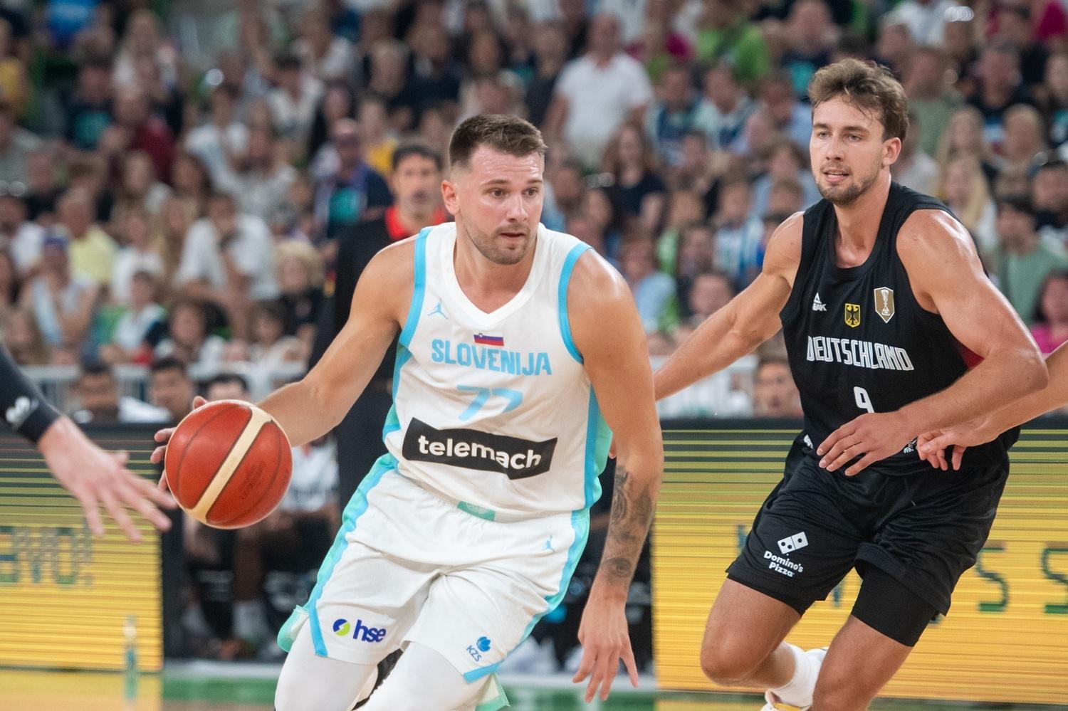 LJUBLJANA, SLOVENIA - 2025/08/08: Luka Doncic (R) of Slovenia and Franz Wagner (L) of Germany are seen in action during the International Friendly basketball match between Slovenia and Germany at Arena Stozice. Final score was Slovenia 89: 103 Germany. (Photo by Milos Vujinovic/SOPA Images/LightRocket via Getty Images) SOPA Images via Getty Images