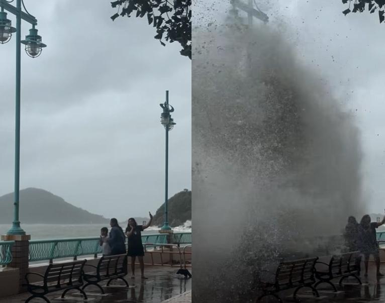 颱風樺加沙|海怡半島兩大人帶細路觀浪自拍被衝倒。(網上影片)
