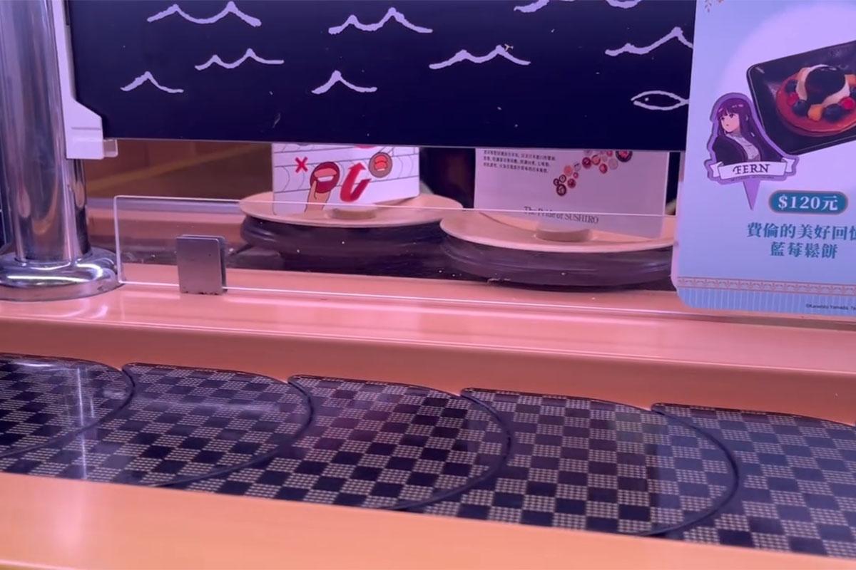 台中一間壽司郎有兒童把筷子伸到迴轉帶上,起初只是擋住盛載廣告的壽司碟。(Threads用戶rain__0808__影片截圖)