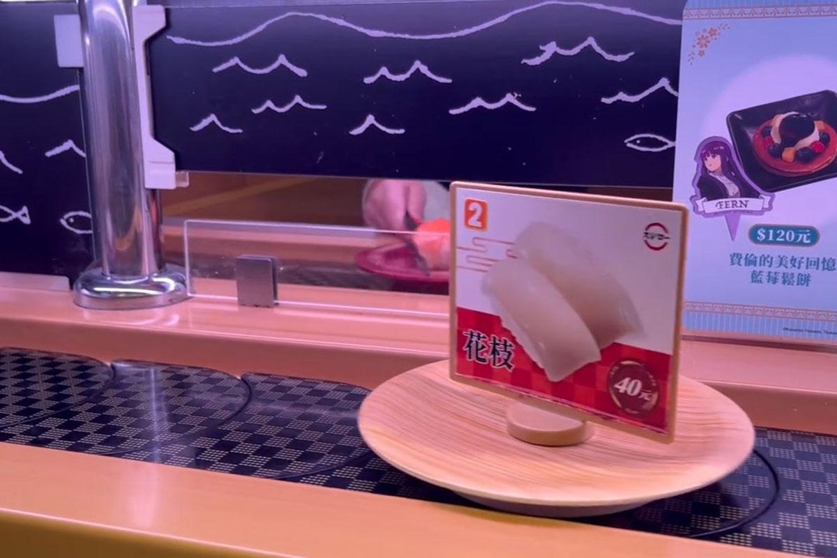 台中一間壽司郎有兒童把筷子伸到迴轉帶上,擋住一碟三文魚壽司。(Threads用戶rain__0808__影片截圖)