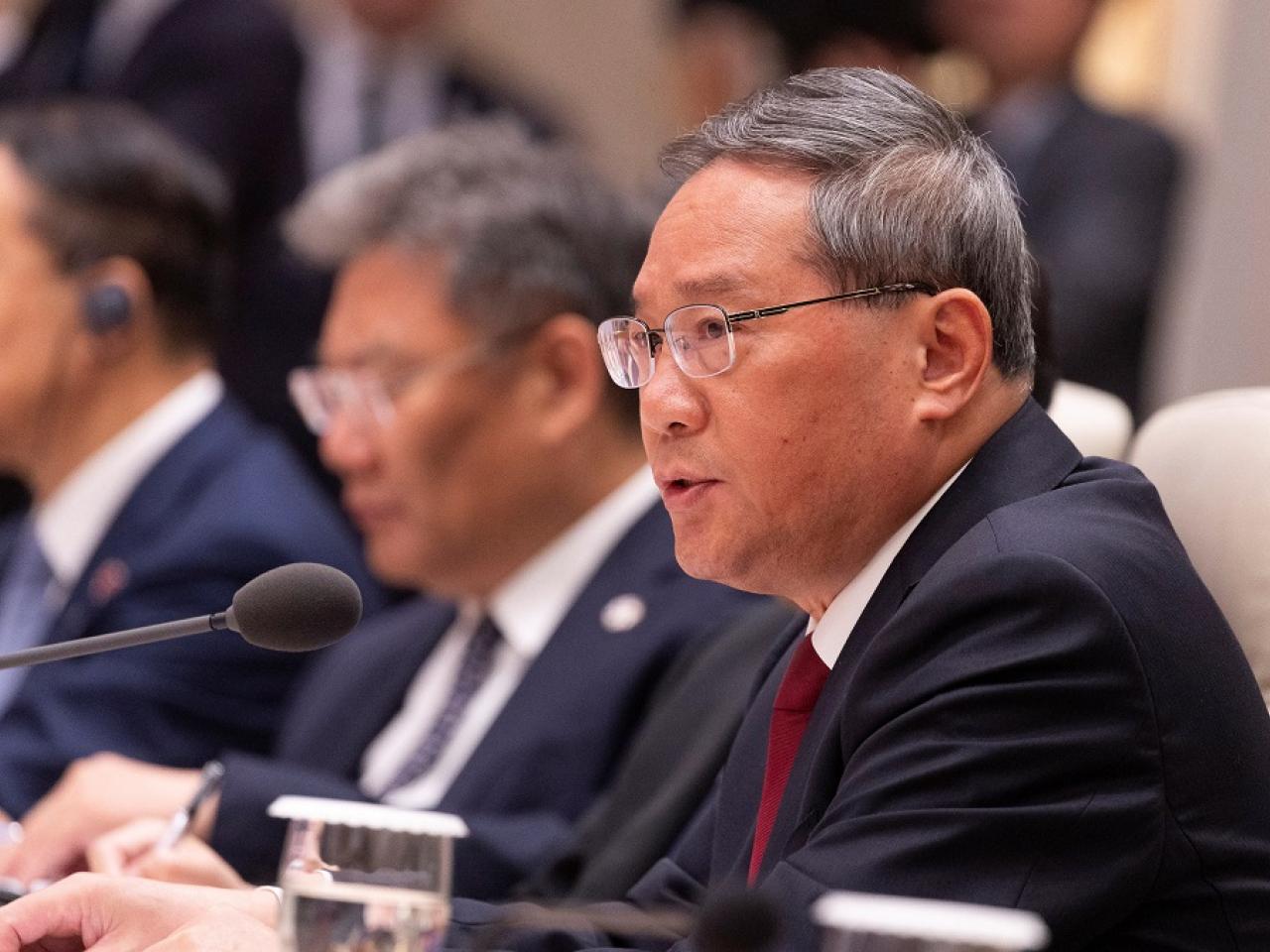 李強在中日韓領導人會議上強調,必須反對貿易保護主義,保護自由貿易和經濟全球化。(路透社)