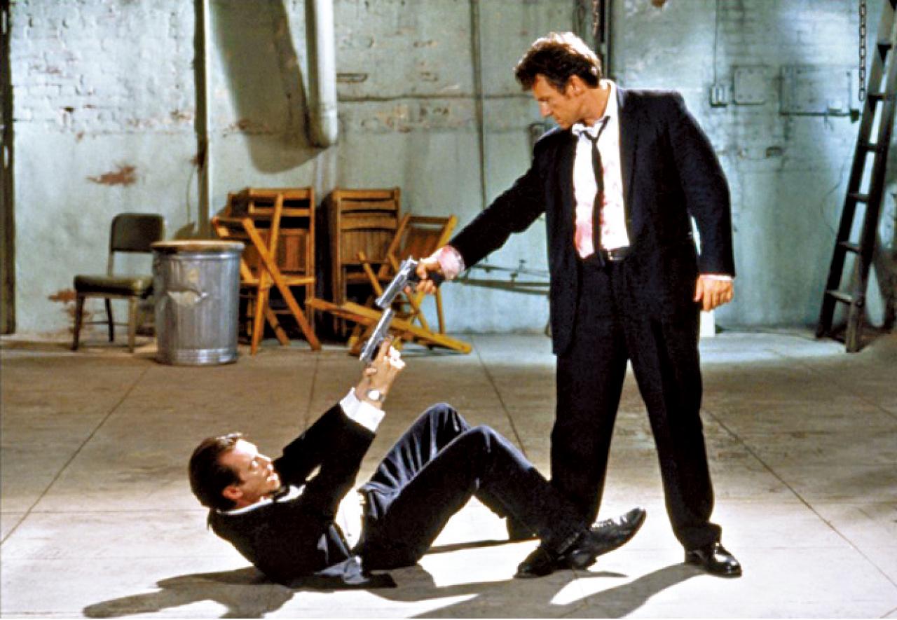 《Reservoir Dogs》中的一場雙槍對峙,令我想起John Woo。