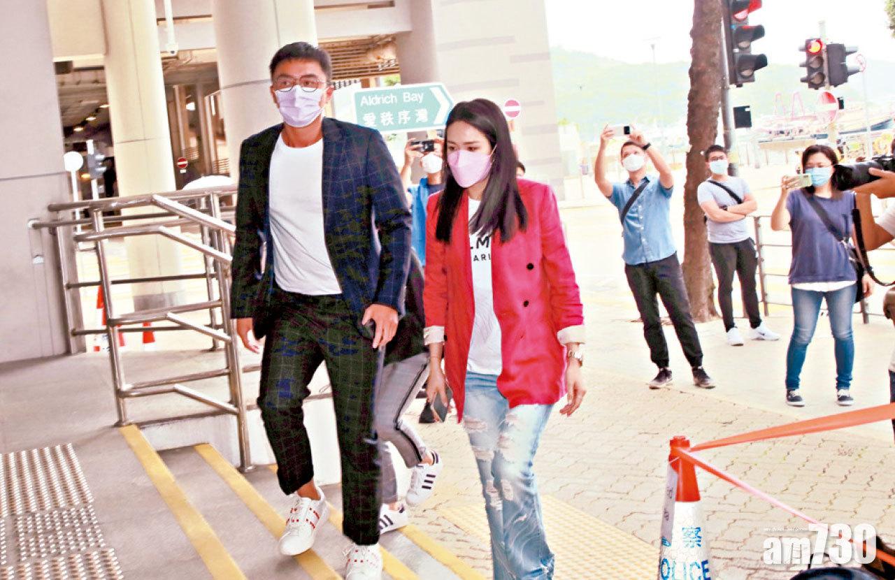 楊明、莊思明到庭時並肩而行。