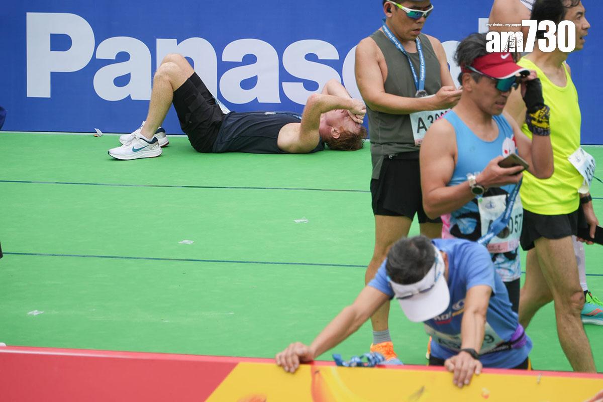 渣打馬拉松2月12日舉行,跑手陸續抵達設於銅鑼灣維多利亞公園的終點。(李睿哲攝)