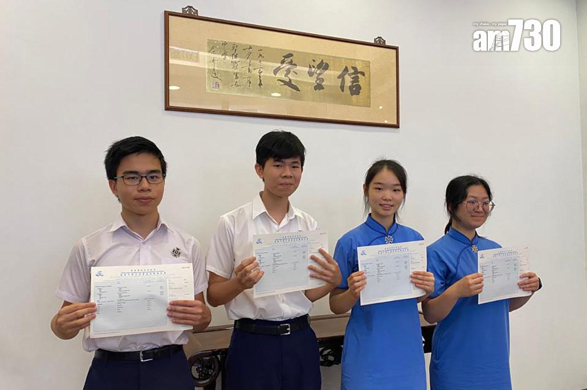 聖保羅男女中學「超級狀元」藍仲宏(左二)和古冰心(右二)。(鄭惠文攝)