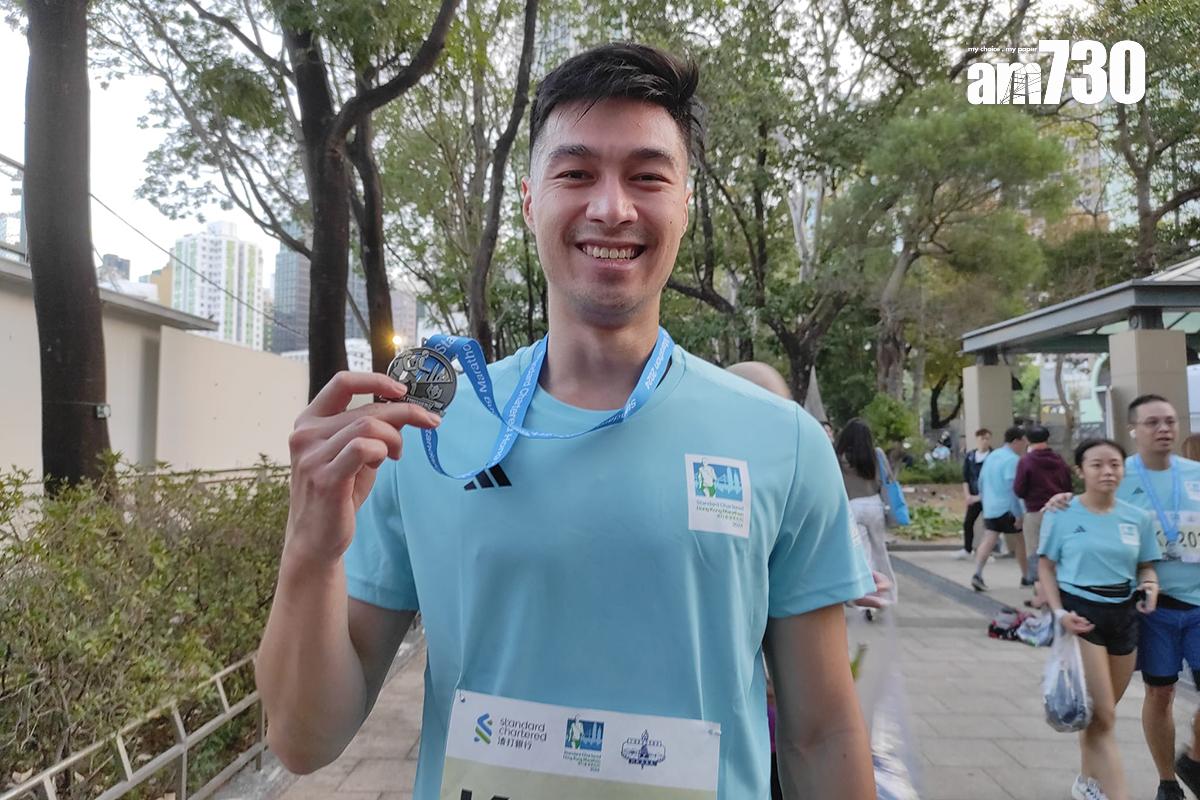 首次參加10公里賽的夏先生,滿意取得50分鐘的成績。(李朗僑攝)