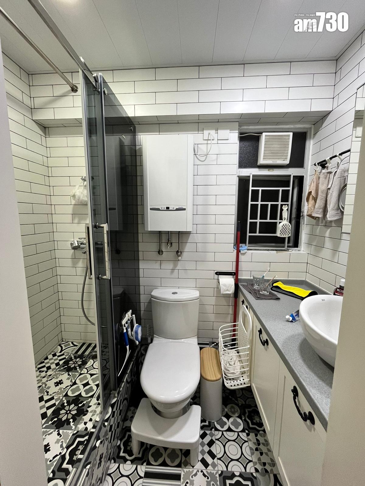 浴室與廚房同料及設計相同,以黑白色為主調,實用又易打理。(代理提供)