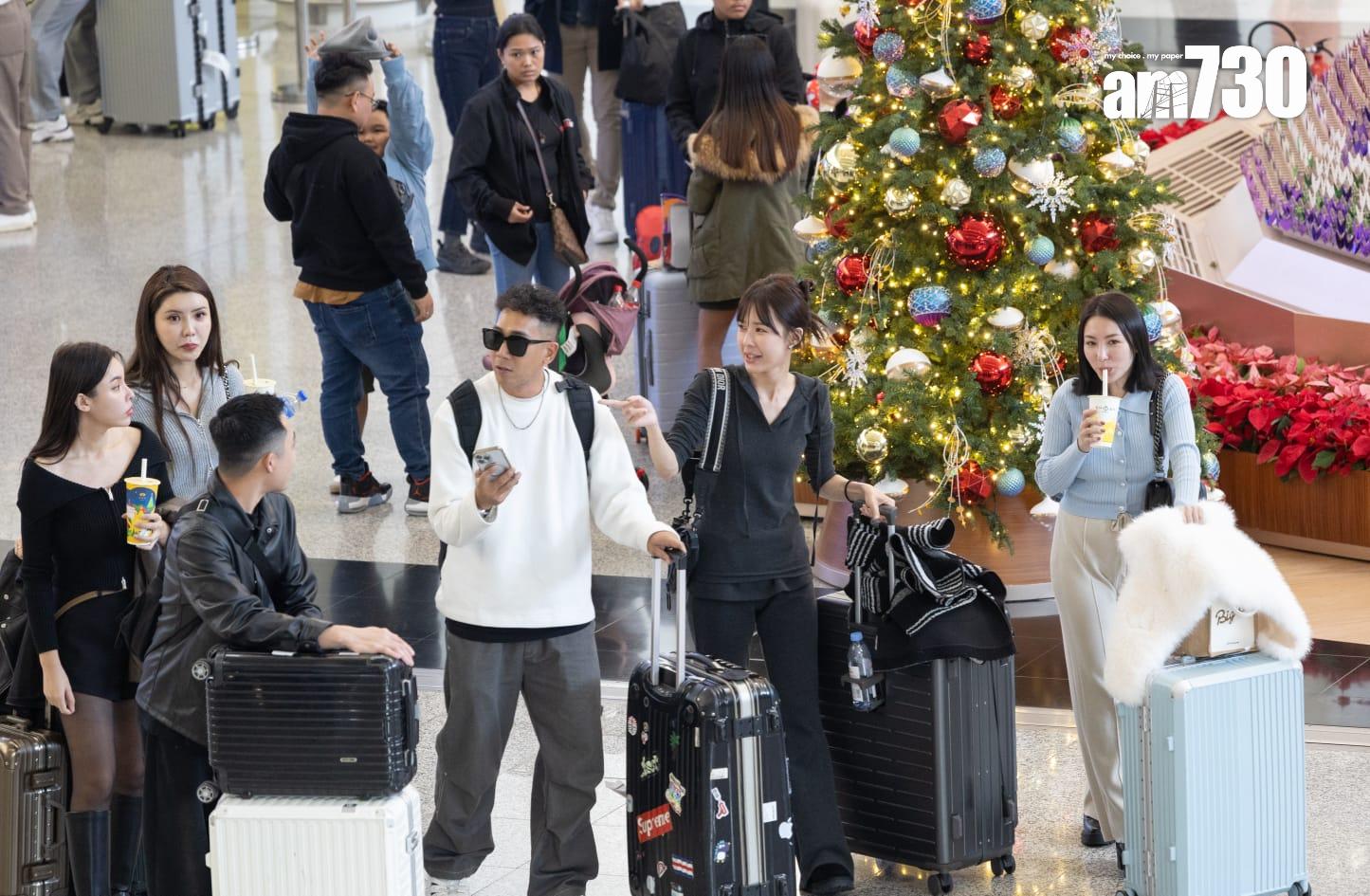 聖誕節翌日不少港人陸續回港。(蘇文傑攝)